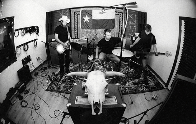 The band Lift to Experience playing together in their studio