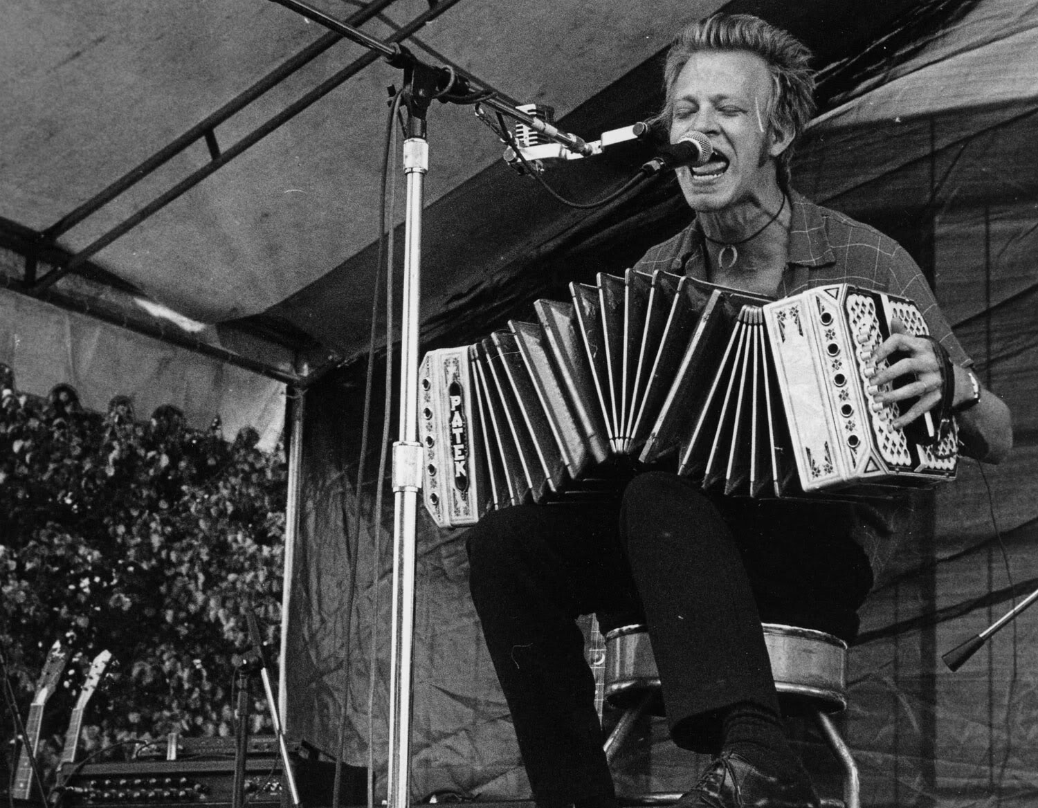 16 Horsepower bandleader, David Eugene Edwards, plays concertina on stage